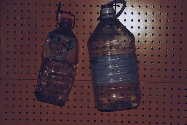 empty plastic bottles on a green background