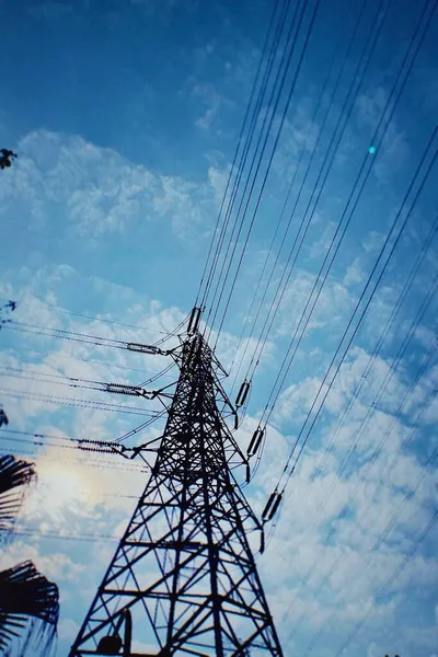 high voltage power lines and blue sky