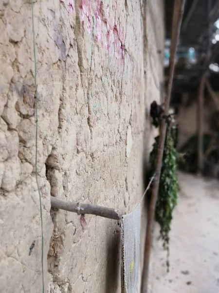 old wooden fence with a white wall