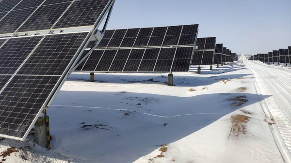 solar panel with snow and white clouds
