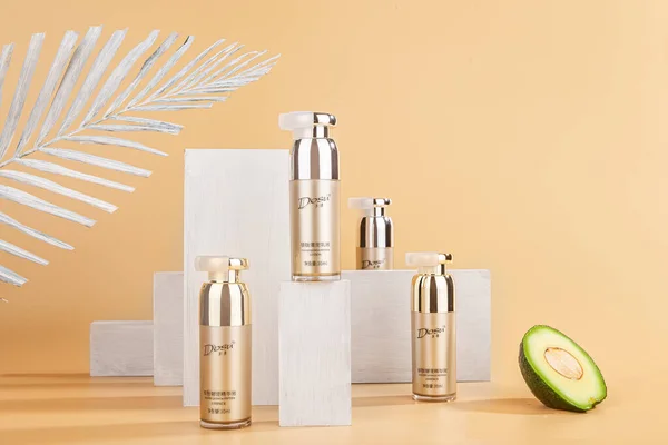 composition with cosmetic products and bottles on color background