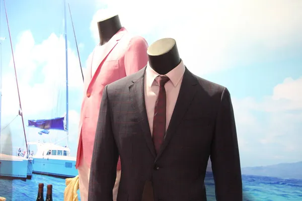businessman in suit with tie and scarf on mannequin