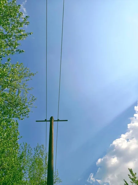 high voltage power lines and blue sky