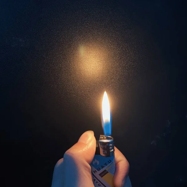 burning candle in the hand