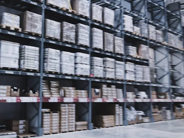 warehouse shelves with many boxes in the store