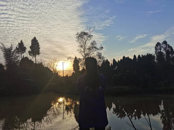 silhouette of a man in a lake