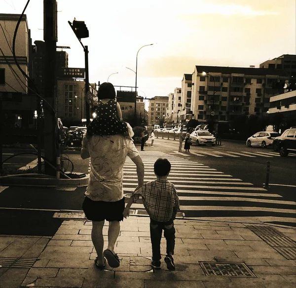 black and white photo of a man and woman in the city