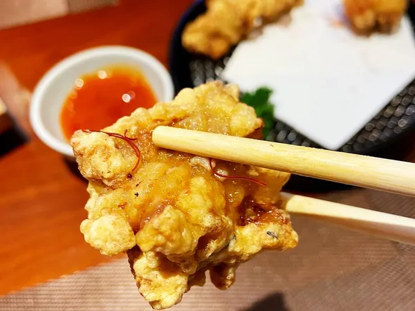 fried chicken with sauce and vegetables