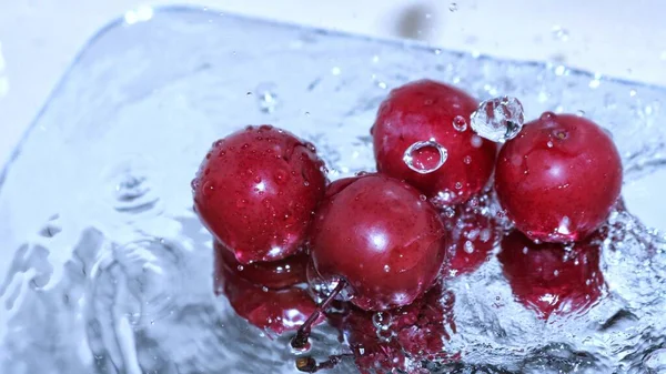 water splash with red berries and splashes