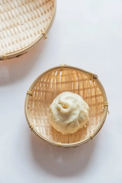 close up of a white bowl with steamed egg