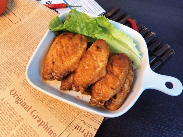 fried chicken with sauce and vegetables