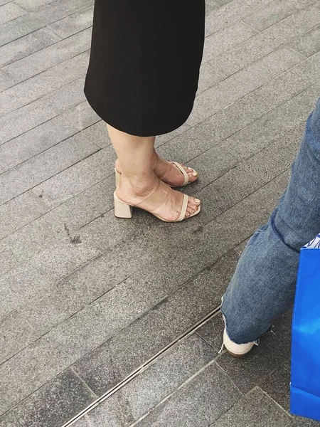 feet of a woman with a pair of legs