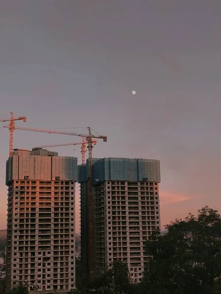 construction site with cranes and building