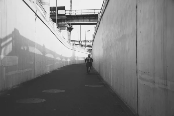 black and white photo of a man and woman in the city