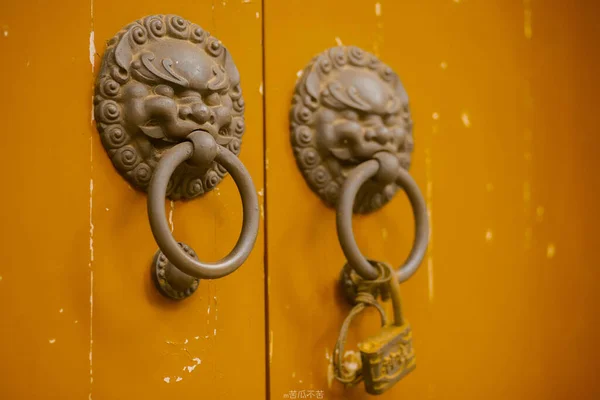 old golden door handle in the historical museum of the ancient city of thailand