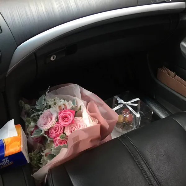 wedding bouquet with red roses in the car