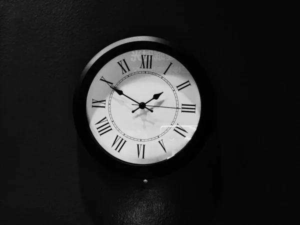 black clock on a dark background