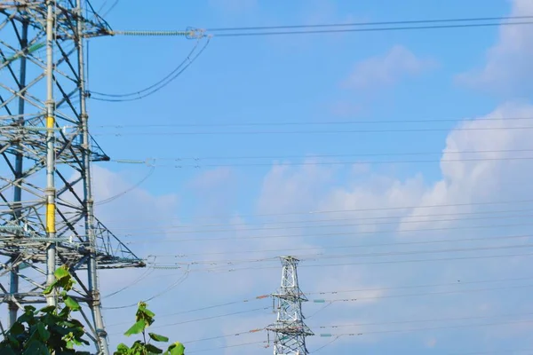 high voltage power line on blue sky background