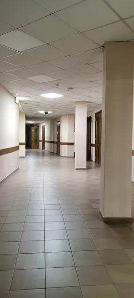 empty corridor with white walls and floor