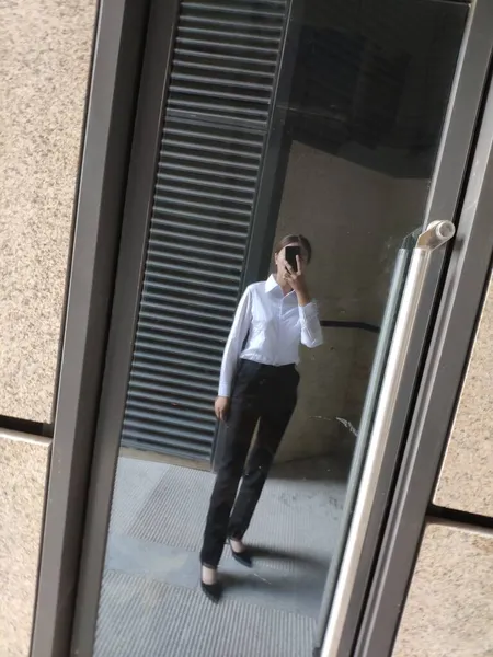 young business woman with mobile phone in the office