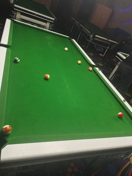 pool with green grass and balls