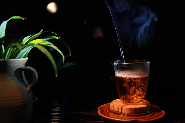 stock image hot coffee in a glass cup on a wooden table