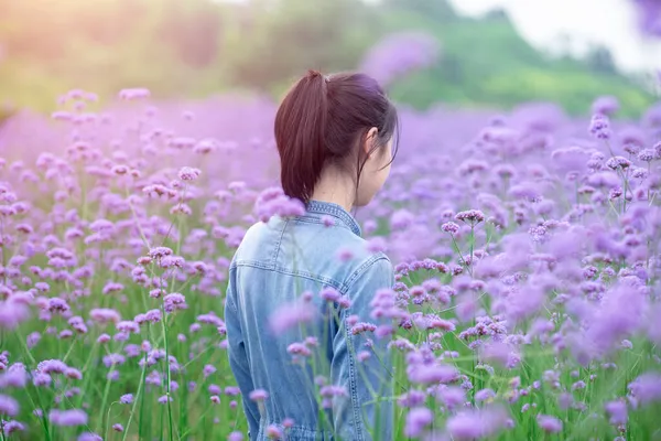 beautiful young woman in a field of lavender