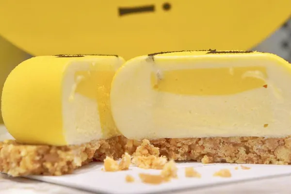 close up of a yellow and white chocolate bar with lemon and honey