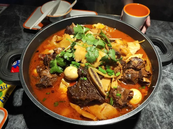 a cuisine photo of a dish of beef