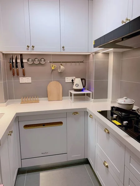 modern kitchen interior with white and blue appliances