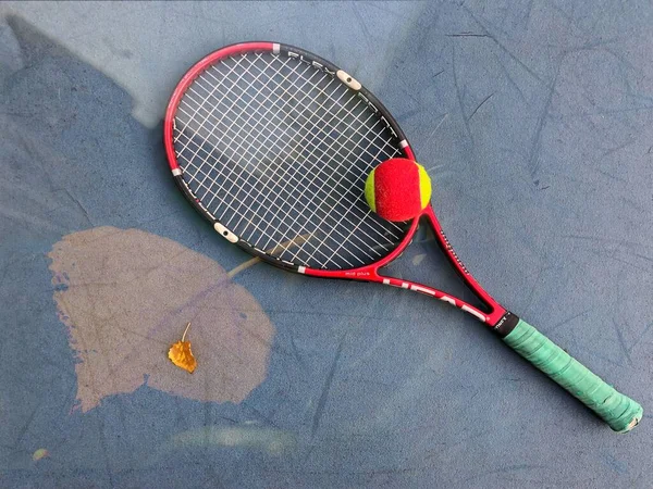 tennis racket and ball on a white background