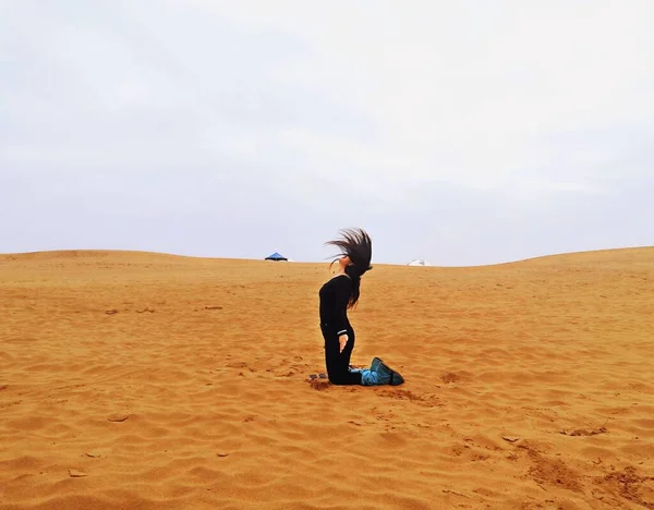 young woman in a desert