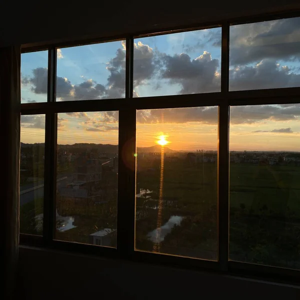 window with sunset sky and clouds
