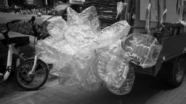 black and white image of a motorcycle in the city