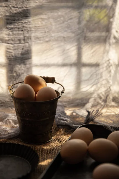 eggs in a wooden box on a rustic background