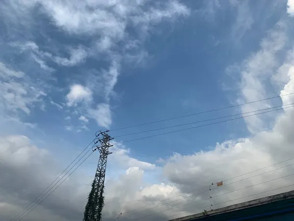 high voltage power lines and blue sky