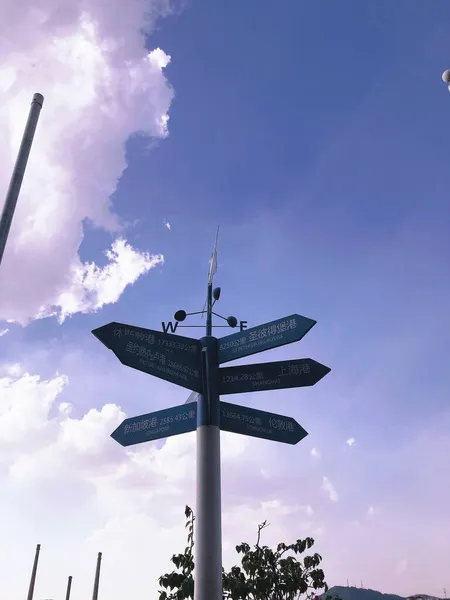 street sign with a blue sky