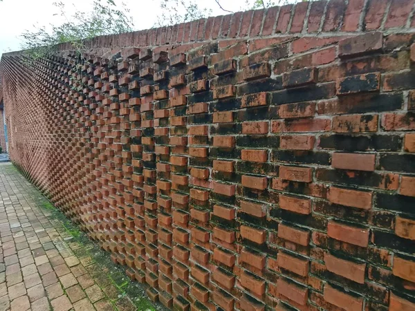 old brick wall with red and white bricks