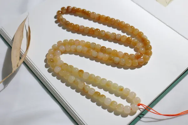 close up of a spiral necklace with beads and pearls