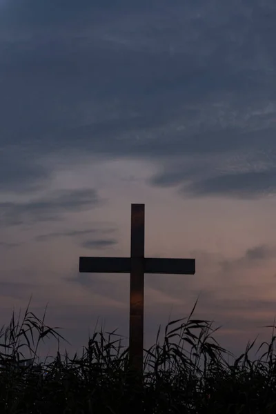 cross on the background of the sunset sky