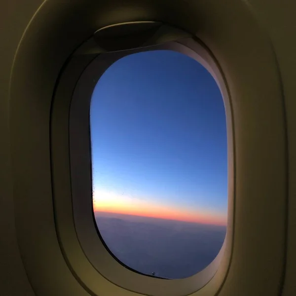 airplane window in the sky