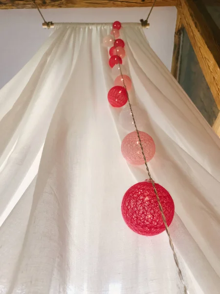 beautiful wedding dress hanging on a window