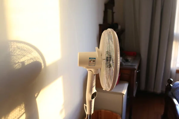 modern interior of a room with a fan