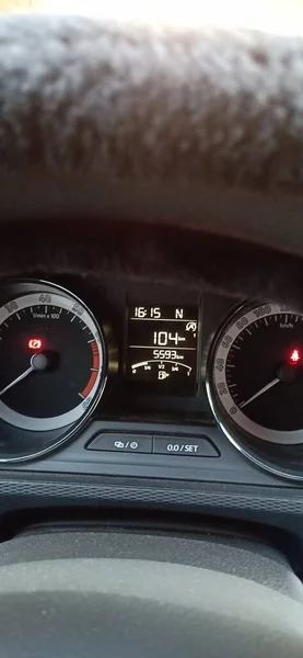 car dashboard with red and white lights