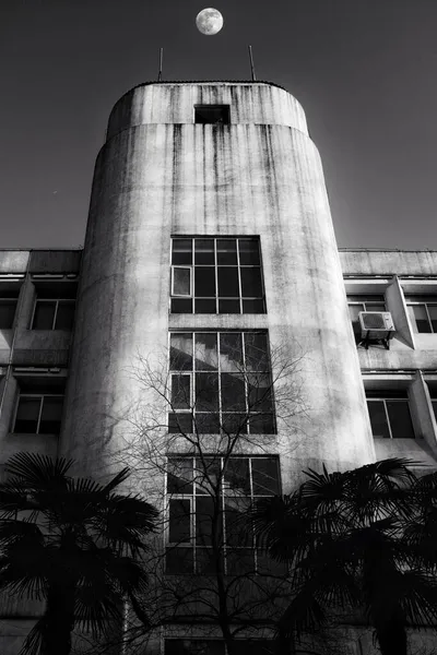 black and white photo of a modern building