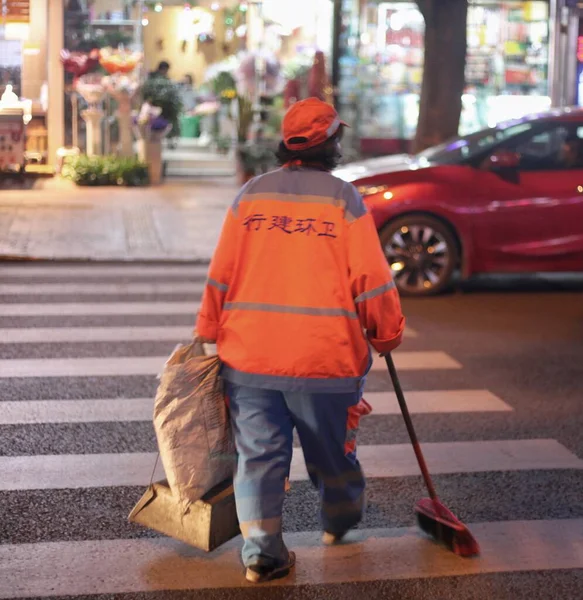 man walking with bag of people in the city