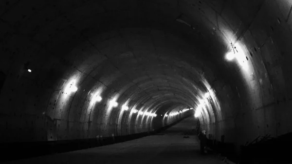 underground tunnel with a large dark concrete.