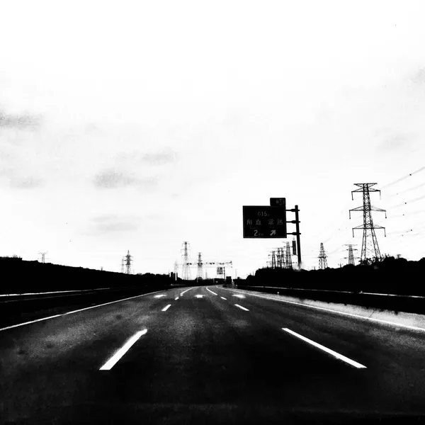 stock image black and white photo of a road in the city