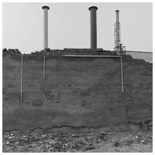 black and white photo of a large industrial factory