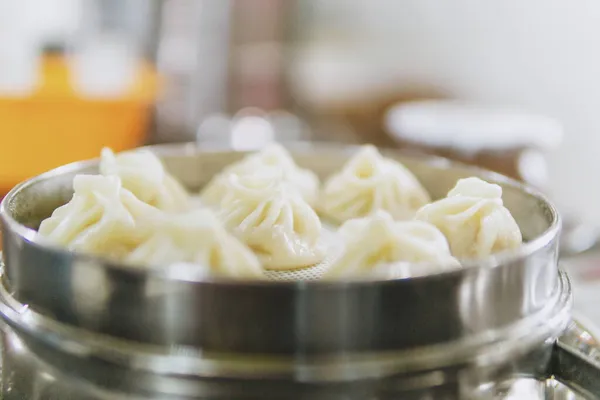 close up of a white bowl with raw meat and butter